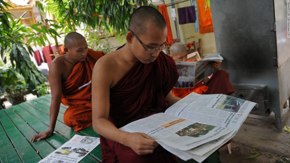 Buddhists monks read newspapers at a monastery in Mandalay. Radical Buddhist monks, including the nationalist 969 Movement&#39;s spiritual leader Ashin Wirathu, have been accused of helping to incite the violence.
