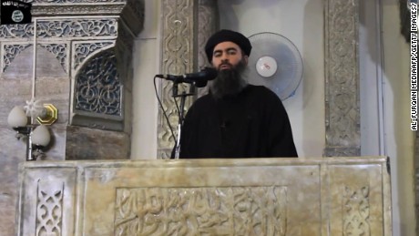 An image grab taken from a propaganda video released on July 5, 2014 by al-Furqan Media allegedly shows the leader of the Islamic State (IS) jihadist group, Abu Bakr al-Baghdadi, aka Caliph Ibrahim, adressing Muslim worshippers at a mosque in the militant-held northern Iraqi city of Mosul. Baghdadi, who on June 29 proclaimed a &quot;caliphate&quot; straddling Syria and Iraq, purportedly ordered all Muslims to obey him in the video released on social media. 
