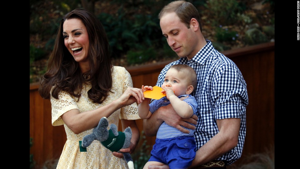 Catherine and William react as their son bites a small present at the bilby enclosure of Sydney&#39;s Taronga Zoo on April 20. One of the zoo&#39;s bilbies was renamed George in honor of the young prince.