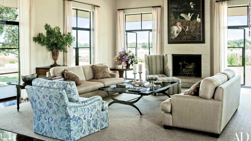 Living Room: Mounted on the living area&#39;s limestone chimney breast is an Adrian Martinez painting, which over looks sofas clad in a Glant fabric, a club chair upholstered in a Groves Bros. print, and a cocktail table designed by Mrs. Bush; the windows are curtained in a Calvin Fabrics linen, and the ammonite fossils displayed atop the pedestal table were found on the property. &lt;a href=&quot;http://www.architecturaldigest.com/celebrity-homes/2014/laura-and-george-w-bush-prairie-chapel-ranch-texas-article?mbid=synd_cnn&quot; target=&quot;_blank&quot;&gt;See more at ArchDigest.com&lt;/a&gt;