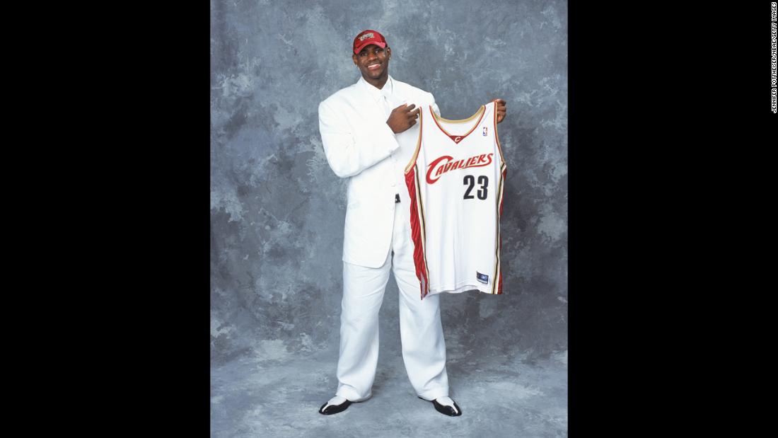 James poses with his new Cleveland Cavaliers jersey after he was drafted in June 2003.