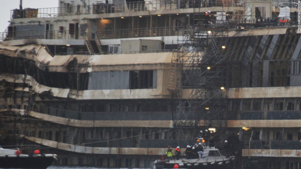 Experts inspect the ship&#39;s damage in January. They boarded the vessel to collect new evidence, focusing on the ship&#39;s bridge and the onboard elevators.