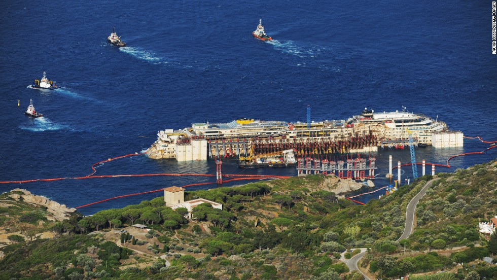 Tugboats pull the Costa Concordia after the first stage of the refloating operation on Wednesday, July 16. 