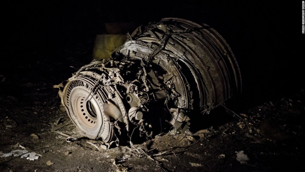  Debris smoulders in a field near the Russian border. 