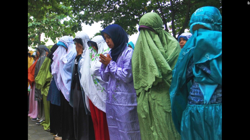 Students attend a prayer July 18 in Central Java, Indonesia. Their teacher John Paulissen was a passenger on Flight 17.