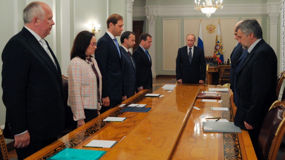 Russian President Vladimir Putin, center, and members of his government observe a moment of silence on Thursday, July 17.