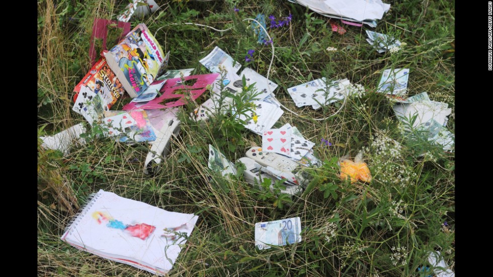 Playing cards and euros are seen at the crash site.