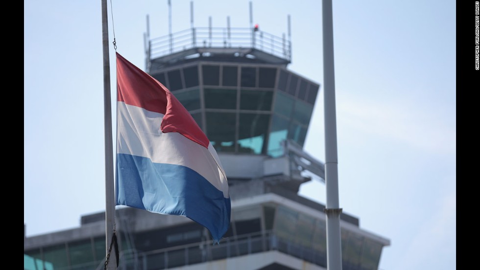 The Dutch flag flies at half-staff July 18 at Amsterdam&#39;s Schiphol Airport.