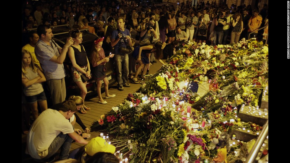 People leave flowers for the victims at the Dutch Embassy in Kiev.