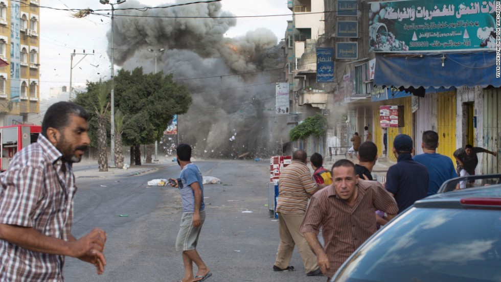 An explosion rocks a street in Gaza City on Friday, July 18.