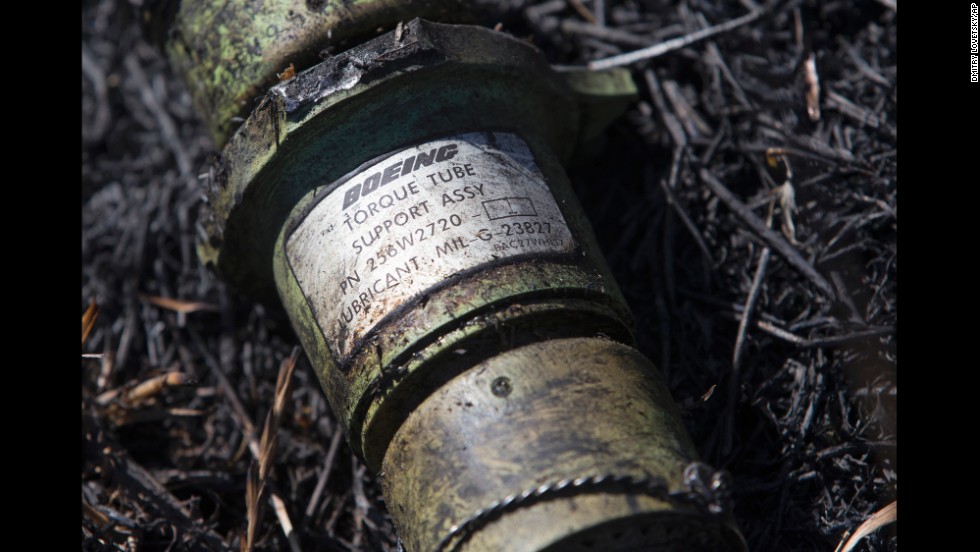 A piece of the plane lies in the grass in eastern Ukraine&#39;s Donetsk region on July 21, 2014.