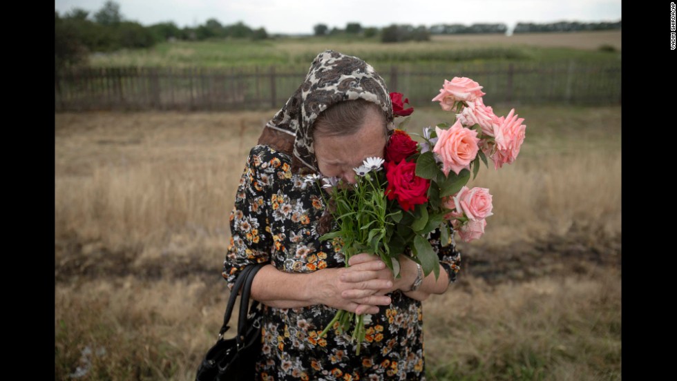 A woman cries July 22 during a service near the crash site.