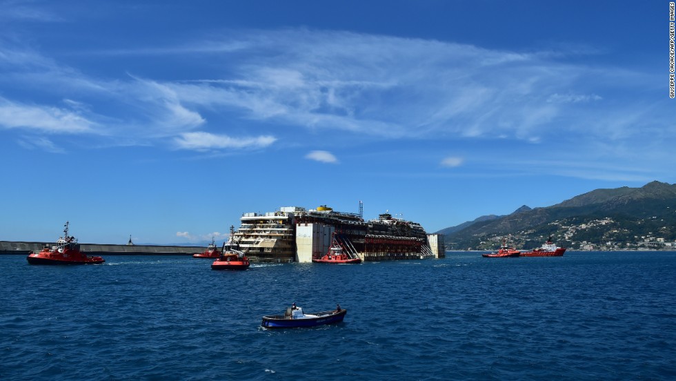 The Concordia is towed into the port of Genoa on July 27. 