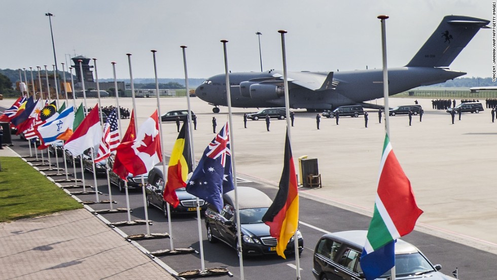 Hearses carrying the coffins with the remains of the victims leave Eindhoven airbase on July 26