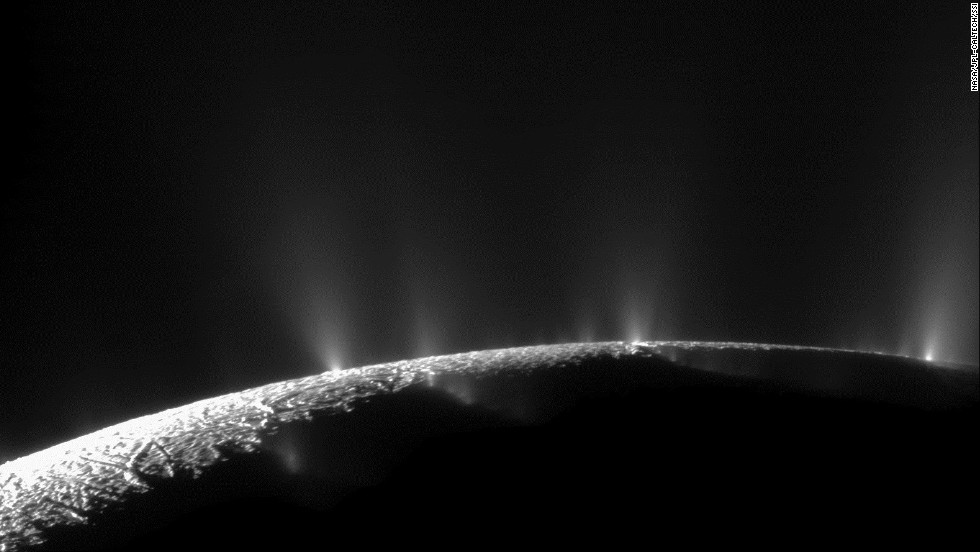 Plumes of water ice and vapor shoot up from the surface of Saturn&#39;s moon Enceladus in this two-image mosaic taken by Cassini in November 2009. Analysis by NASA scientists indicated that water can reach the Saturnian moon&#39;s surface.