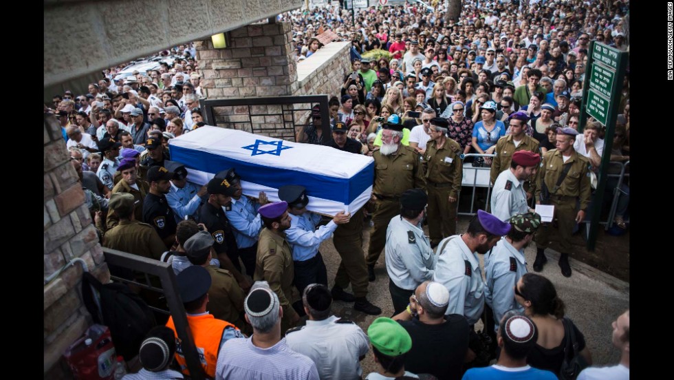 An honor guard caries the coffin of Israeli Lt. Hadar Goldin during his funeral in Kfar-saba, Israel, on August 3. Goldin was thought to have been captured during fighting in Gaza but was later declared killed in action by the Israel Defense Forces.