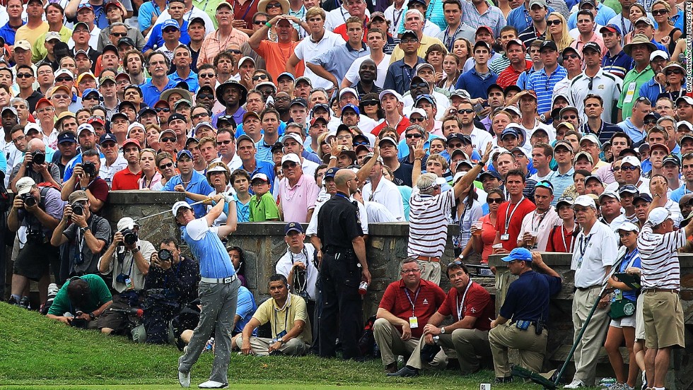 Here we see McIlroy teeing off from the 10th hole during the final round of the 2011 U.S. Open at the Congressional Country Club in Bethesda, Maryland.&lt;br /&gt;&lt;br /&gt;A short time later, the 21-year-old Northern Irishman would stand on the 18th green and triumphantly lift his first major title.&lt;br /&gt;&lt;br /&gt;The win was all the more meaningful to McIlroy as it followed on from his final-day collapse at the Masters just a couple of months earlier.&lt;br /&gt;&lt;br /&gt;&quot;He hit this shot literally inches from the hole,&quot; Cannon said. &quot;I love the way the whole crowd is following his ball, apart from the poor policeman and marshals doing their duties, that is.&quot;