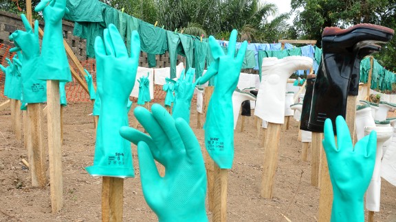 A view of gloves and boots used by medical staff, drying in the sun, at a center for victims of the Ebola virus in Guekedou, on April 1, 2014. The viral haemorrhagic fever epidemic raging in Guinea is caused by several viruses which have similar symptoms -- the deadliest and most feared of which is Ebola. AFP PHOTO / SEYLLOU (Photo credit should read SEYLLOU/AFP/Getty Images)