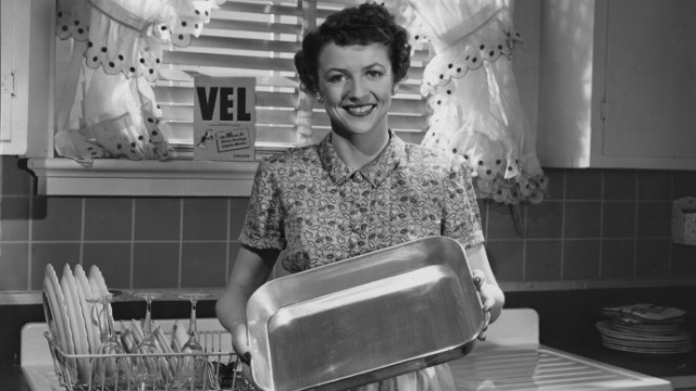 A 1960s housewife demonstrates the power of Vel dish soap
