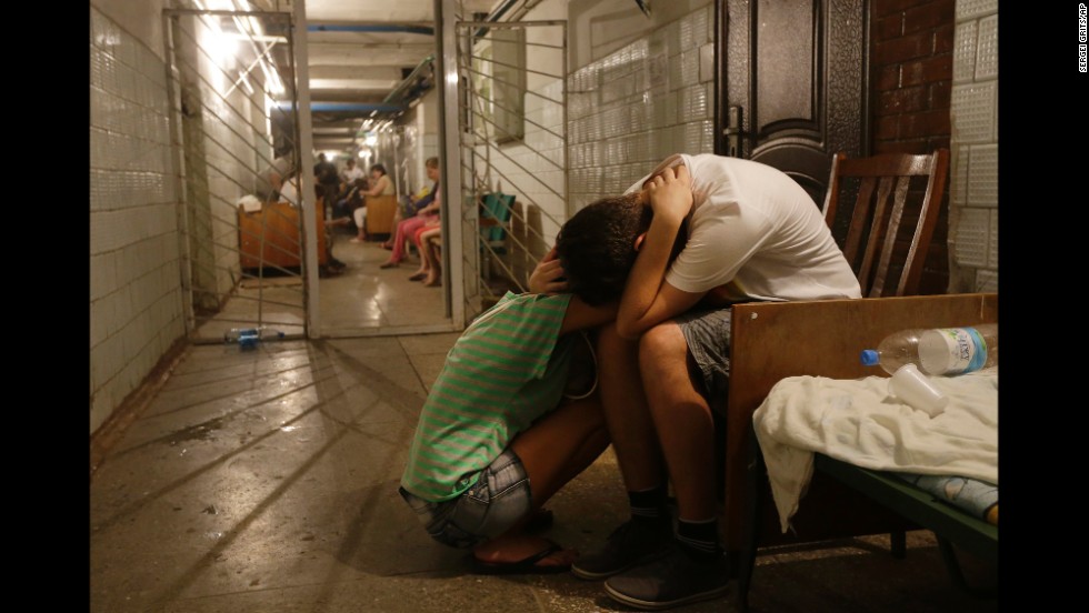 Residents of eastern Ukraine cry in a hospital basement being used as a bomb shelter August 7 in Donetsk.