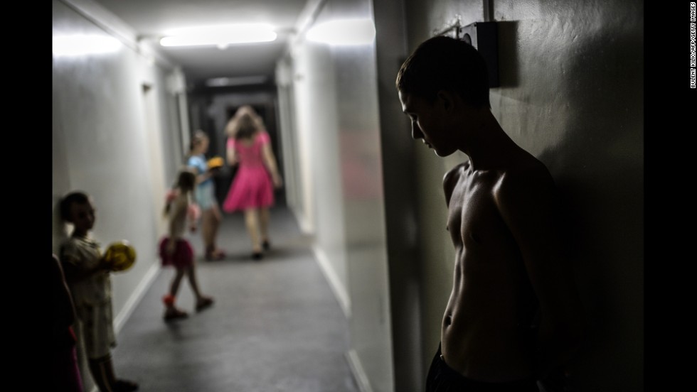 A boy stands in a hallway of a refugee hostel run by pro-Russian rebels in Donetsk on Monday, August 4.