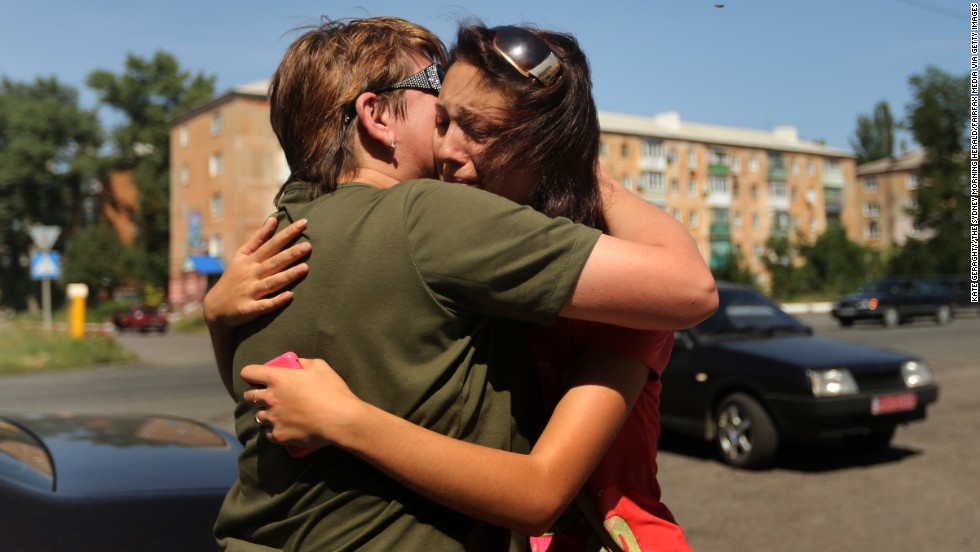 A woman says goodbye to her mother as she flees her home in Shakhtersk, Ukraine, on Tuesday, July 29. &lt;a href=&quot;http://www.cnn.com/2014/05/27/world/gallery/ukraine-after-election/index.html&quot;&gt;See more photos of the crisis from earlier this year&lt;/a&gt;