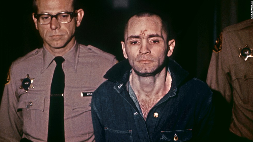 Manson, head shaved and beardless, is led his sentencing hearing on March 29, 1971. He received the death penalty as well.