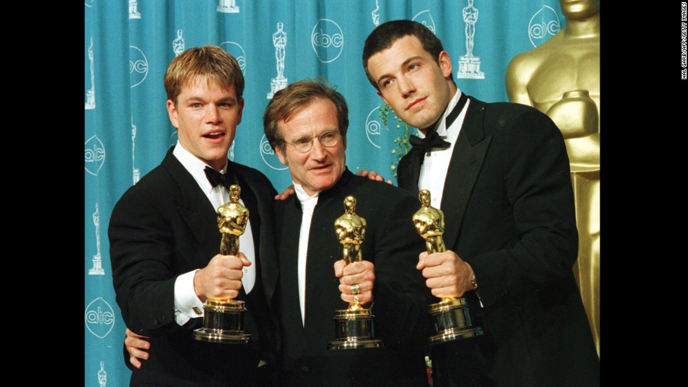 Actor-writers Matt Damon, left, and Ben Affleck, right, pose with Williams, holding the Oscars they won for &quot;Good Will Hunting&quot; at the 70th annual Academy Awards in 1998. Damon and Affleck won for best original screenplay, and Williams won for best supporting actor.