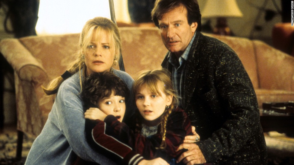 From left, Bonnie Hunt, Bradley Pierce, Kirsten Dunst and Williams hold one another in a scene from the 1995 film &quot;Jumanji.&quot; 