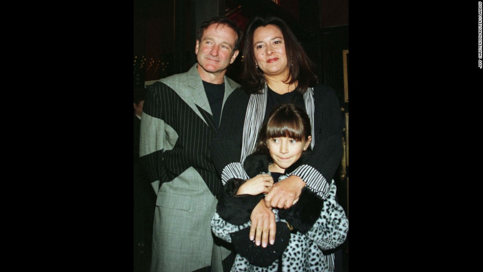 Williams and his wife, Marsha, pose for photographers with their daughter, Zelda, as they arrive at the premiere of the film &quot;Patch Adams&quot; in December 1998 in New York City. 