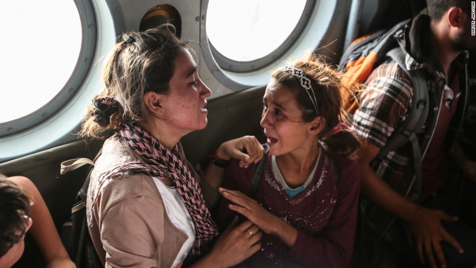 Aziza Hamid, a 15-year-old Iraqi girl, cries for her father while she and some other Yazidi people are flown to safety Monday, August 11, after a dramatic rescue operation at Iraq&#39;s Mount Sinjar. A CNN crew was on the flight, which took diapers, milk, water and food to the site where as many as 70,000 people were trapped by ISIS. But only a few of them were able to fly back on the helicopter with the Iraqi Air Force and Kurdish Peshmerga fighters.