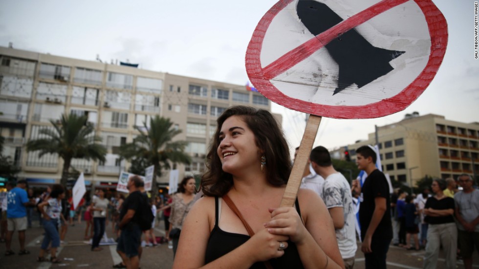 Israelis gather in Tel Aviv during a protest August 14 calling on the government and the army to end Palestinian rocket attacks from Gaza once and for all.