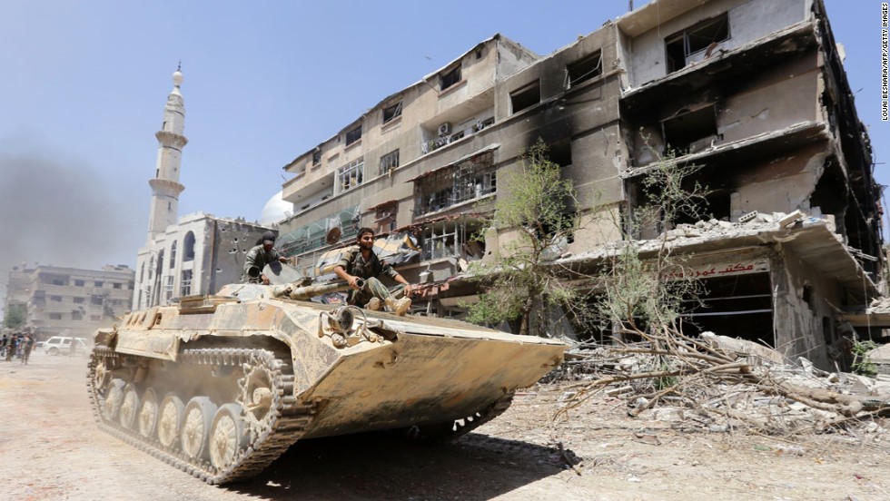 This image was taken during a government guided tour in Mleiha, Syria, one day after Syrian government forces retook the town after a months-long battle with rebels, according to a military source and state television on Friday, August 15.