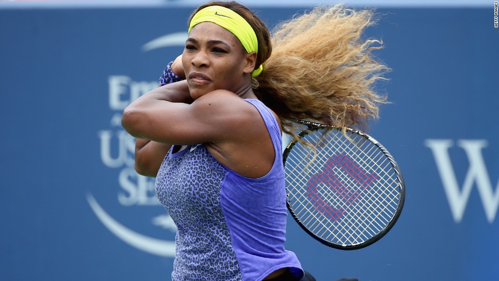 With her hair -- &lt;a href=&quot;/2012/08/15/sport/tennis/serena-venus-roddick-williams-tennis/index.html&quot; target=&quot;_blank&quot;&gt;which she once described as &quot;super crazy&quot;&lt;/a&gt; -- tied back, Serena blasts a shot in a match against Ana Ivanovic in Cincinnati.