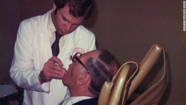 Sandy Halperin was a teacher and practicing prosthodontist at Harvard University in 1979. In this photo he is working on his father, Leon&#39;s, teeth.
