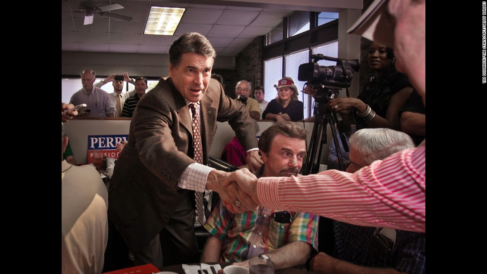 In the inaugural stages of his 2012 presidential run, Perry mingles with a breakfast crowd during a campaign stop at Bazen&#39;s Family Restaurant in Florence, South Carolina, on August 19, 2011. 