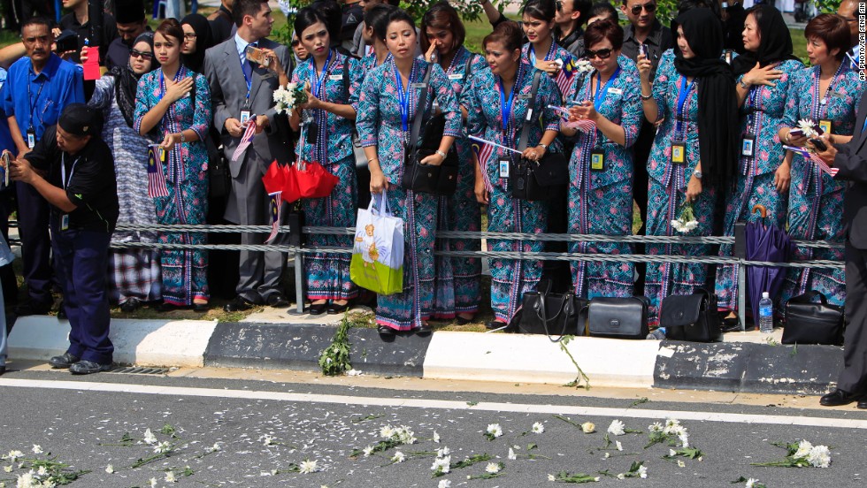 Flowers were thrown onto the street as the hearses passed.