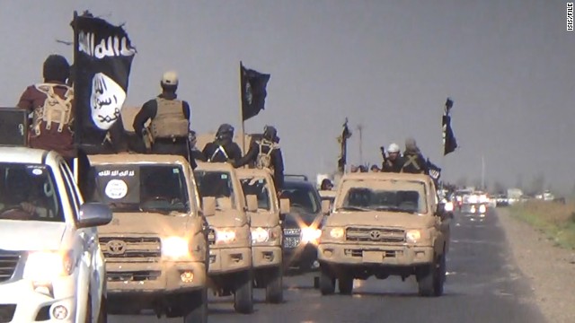 : 	Images of an ISIS parade in the Kirkuk Province
