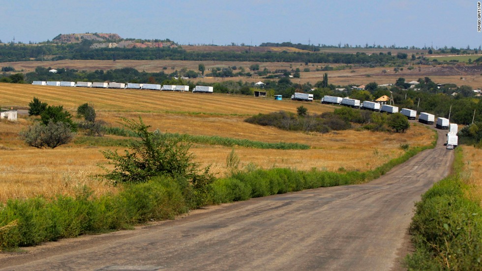 The first trucks of a Russian aid convoy roll on the main road to Luhansk in eastern Ukraine on Friday, August 22. The head of Ukraine&#39;s security service called the convoy a &quot;direct invasion&quot; under the guise of humanitarian aid since it entered the country without Red Cross monitors. 