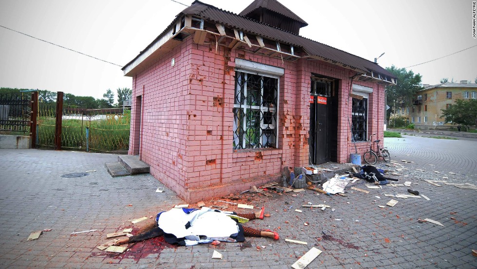 A shell killed two shop keepers outside their store.