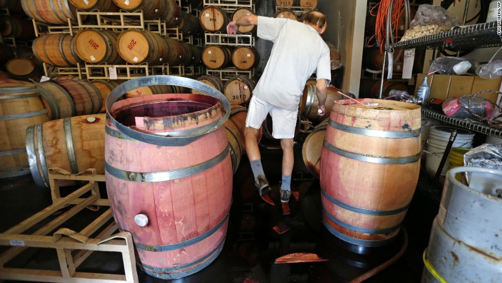 Winemaker Tom Montgomery walks through spilled wine to see the damage at the B.R. Cohn Winery barrel storage facility on August 24 in Napa. 