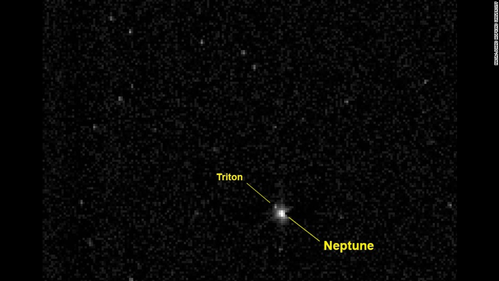 In August 2014, New Horizons crossed the orbit of Neptune, the last planet it would pass on its journey to Pluto. New Horizons took this photo of Neptune and its large moon Triton when it was about 2.45 billion miles from the planet -- more than 26 times the distance between the Earth and our sun.