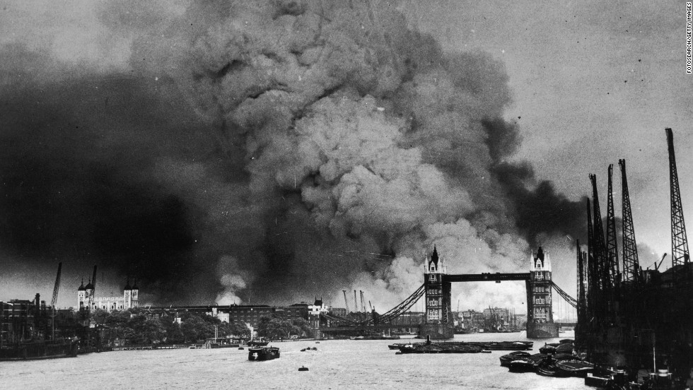Smoke rises behind Tower Bridge during the first mass daylight bombing of London on September 7, 1940. 