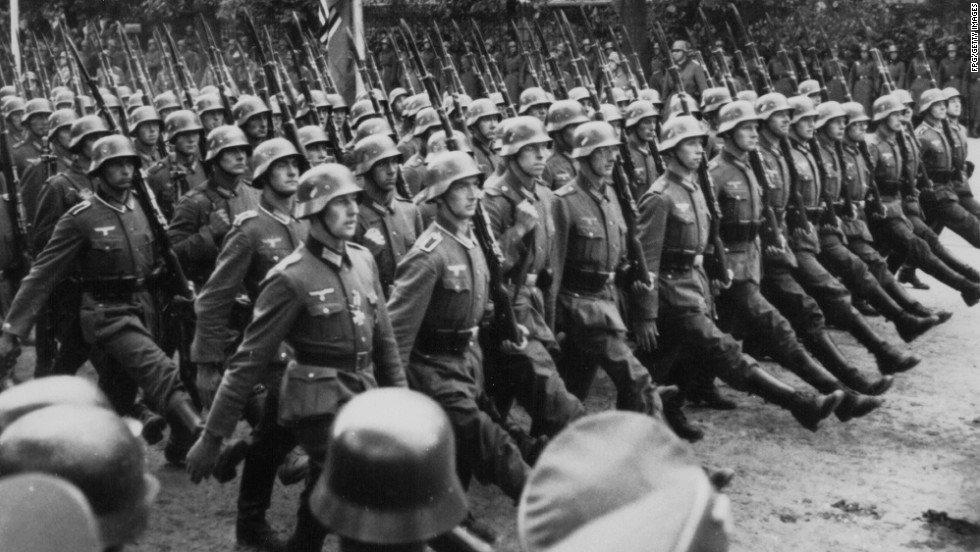 German troops march through occupied Warsaw, Poland, after invading the nation on September 1, 1939, and igniting World War II.