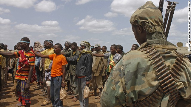 [File] Photo taken on September 22, 2012 shows members of  Al-Shabaab giving themselves up to AU peacekeepers in Somalia.