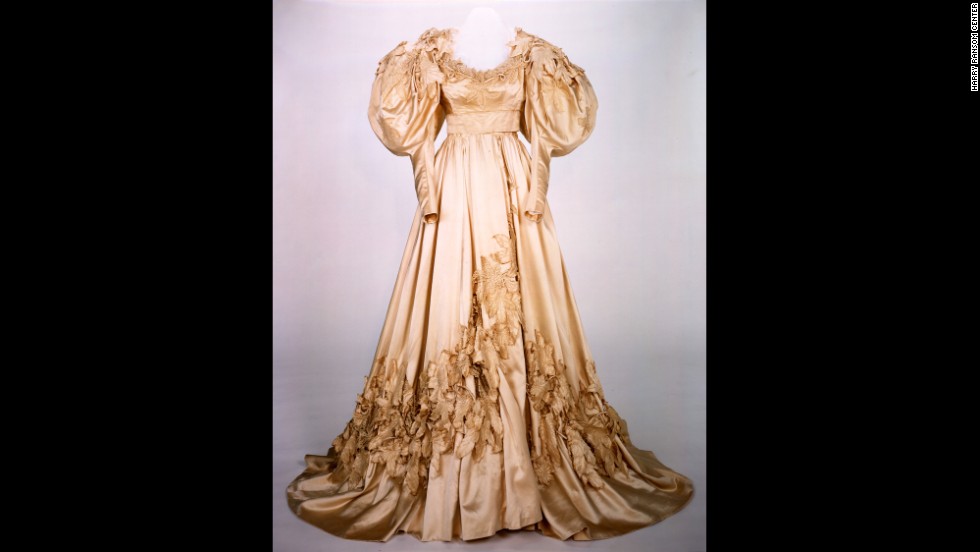 Scarlett&#39;s wedding gown is one of two replicas appearing in the exhibition. This dress and a blue velvet peignoir the character wears in her daughter&#39;s death scene were deemed too delicate and fragile for conservation efforts. In the film, the wedding dress appears bulky and ill-fitting on Scarlett, who has rushed into marriage with Charles Hamilton, borrowing her mother&#39;s gown.
