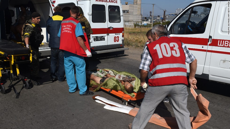 A wounded Ukrainian soldier is helped by a medical team on the outskirts of Mariupol on September 5.