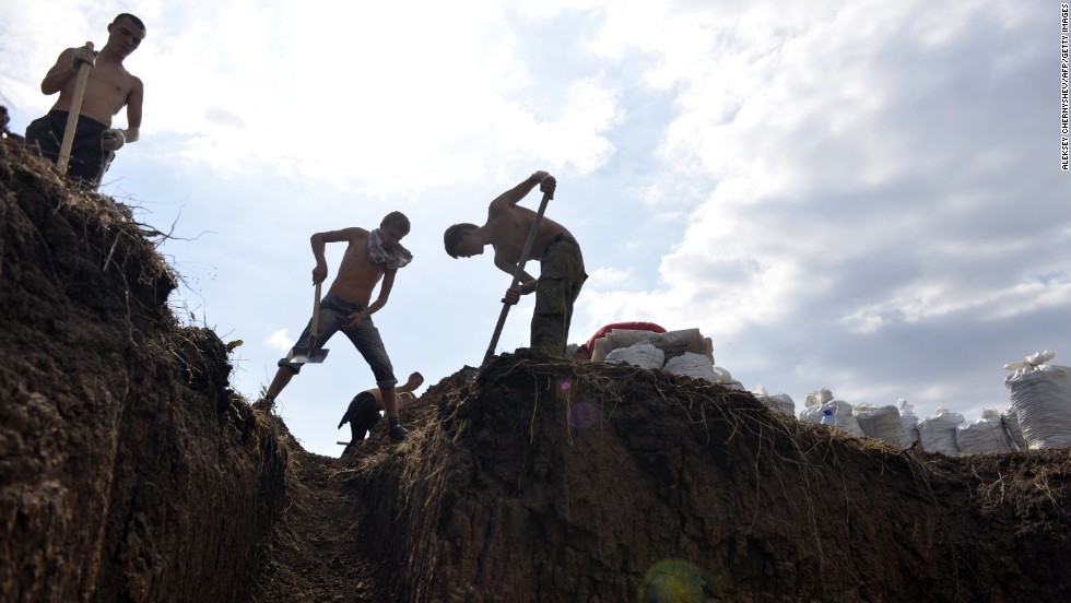 Young residents of Berdyansk, Ukraine, dig trenches September 9 to help Ukrainian forces protect the city from possible rebel attacks. 