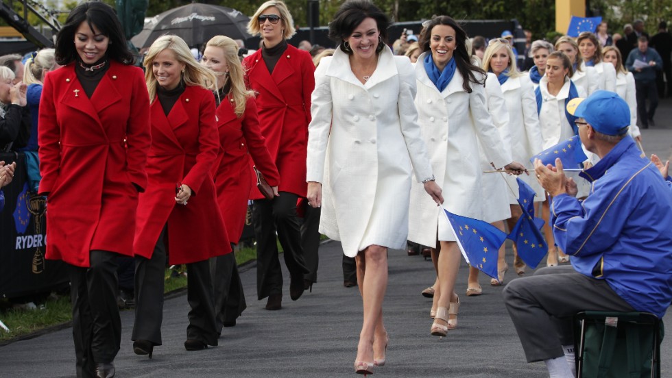 Lisa Pavin (L) and Gaynor Montgomerie (R) lead out the wives and girlfriends during the Opening Ceremony prior to the 2010 Ryder Cup in Wales.