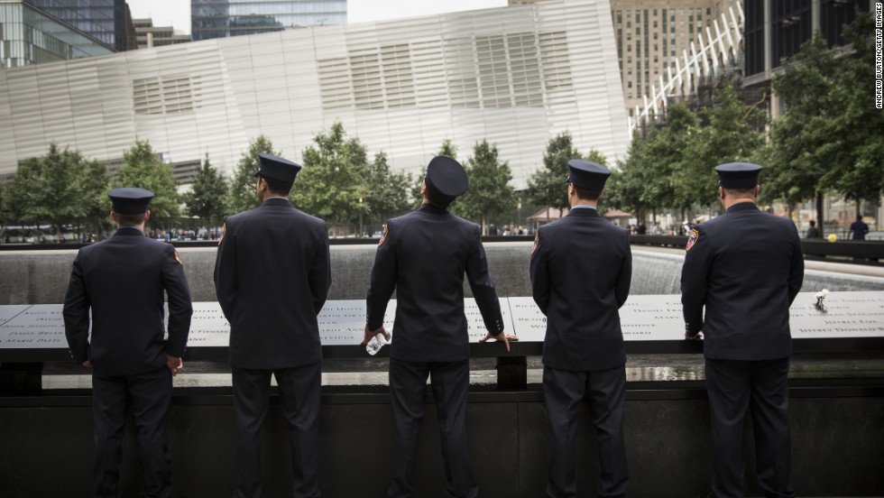 Members of the New York Fire Department take time to reflect.